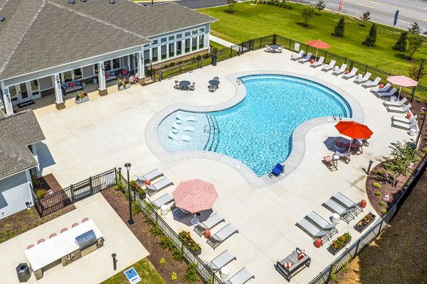 Modern pool with lounge chairs at Prose New Hope Apartments, offering residents a luxurious spot to relax and unwind