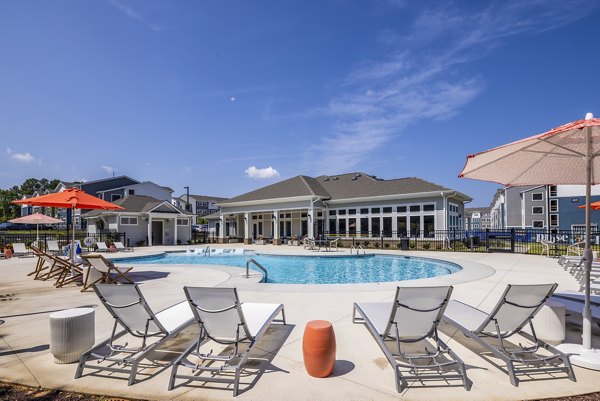 Resort-style pool at Prose New Hope Apartments: Luxury Greystar living with poolside lounges and lush landscaping