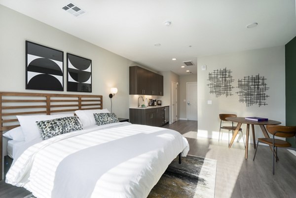Luxury bedroom with stylish decor in Prado Apartments