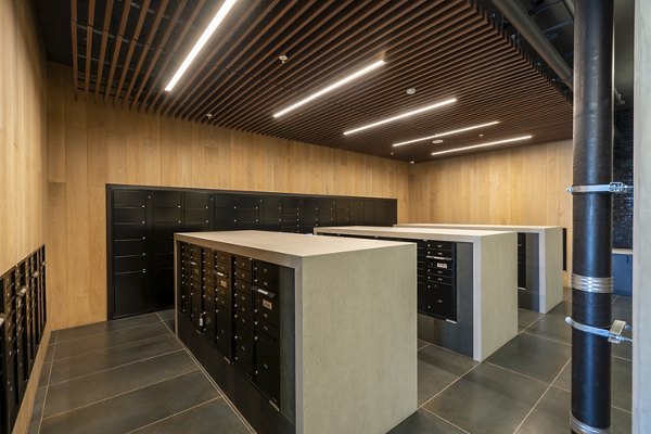 Modern mail room with organized parcel lockers at Prado Apartments