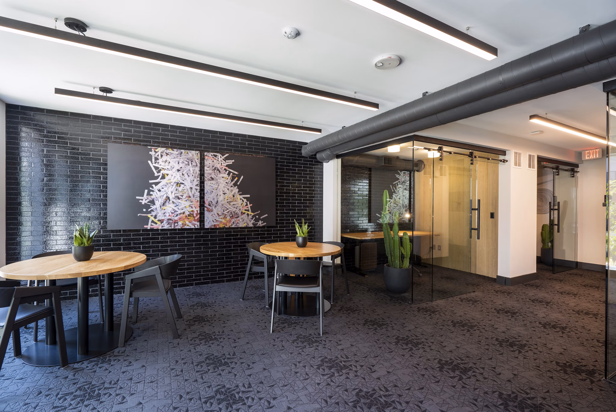 Clubhouse featuring modern seating and artwork at Prado Apartments, luxury living in a vibrant community
