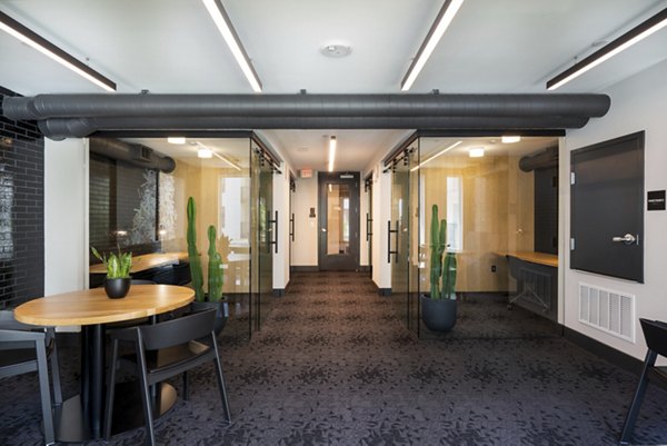 Stylish clubhouse with modern seating at Prado Apartments in  community
