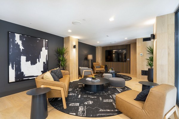 Prado Apartments: Modern clubhouse with stylish seating and fireplace in Atlanta luxury apartments