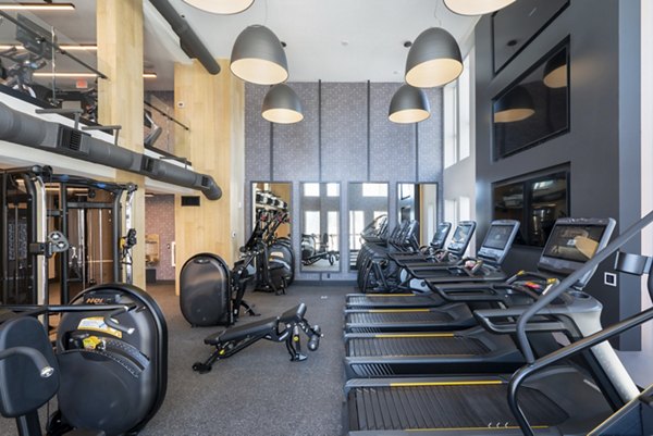 State-of-the-art fitness center with modern equipment at Prado Apartments in Los Angeles, promoting an active luxury lifestyle