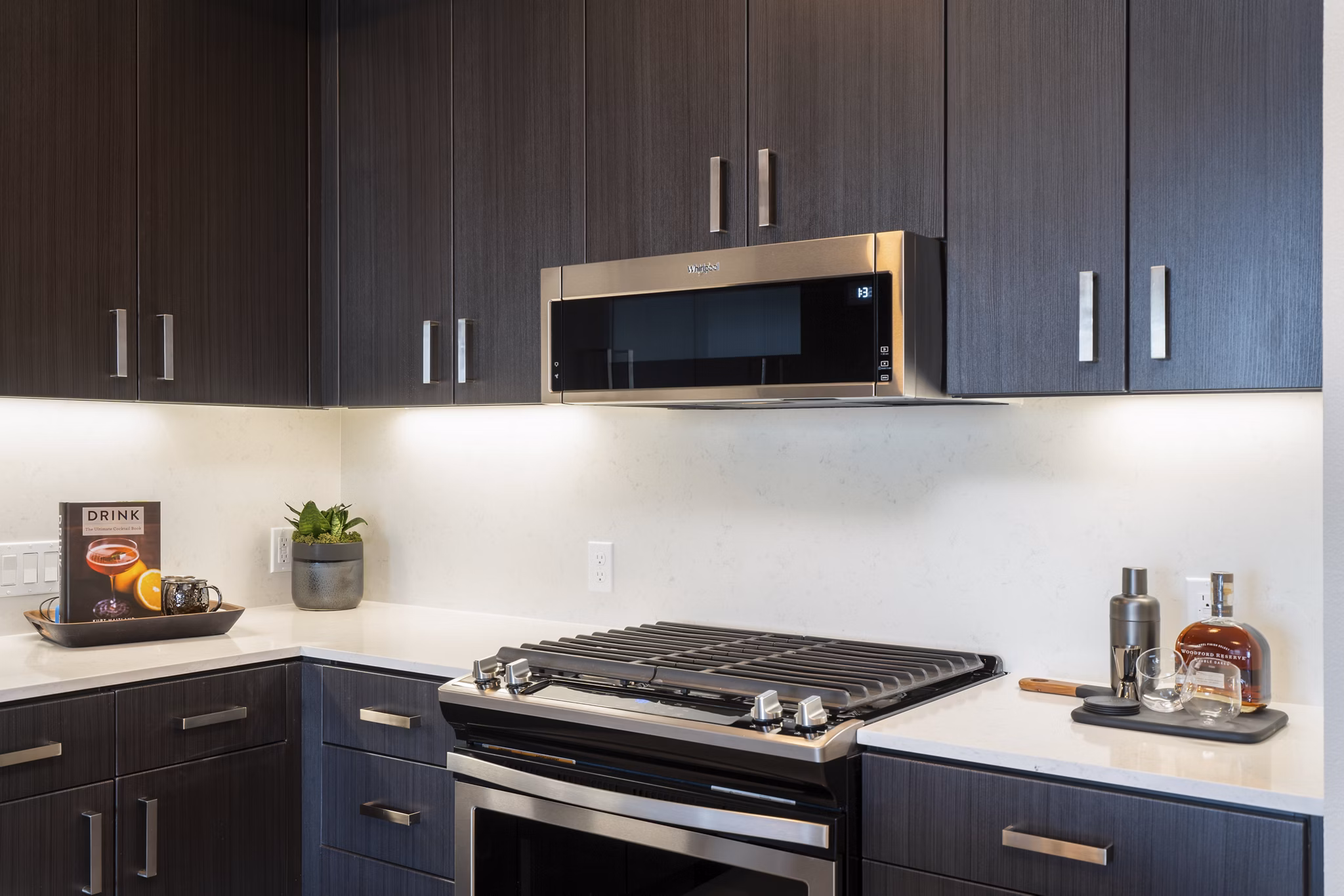 Modern kitchen with stainless steel appliances at Prado Apartments, Greystar luxury apartments in urban setting