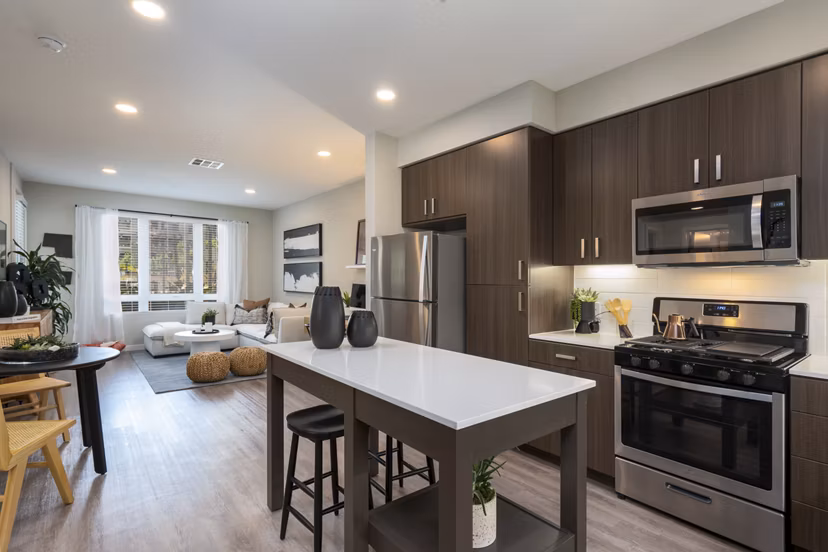 Modern kitchen with sleek cabinetry and stainless-steel appliances at Prado Apartments