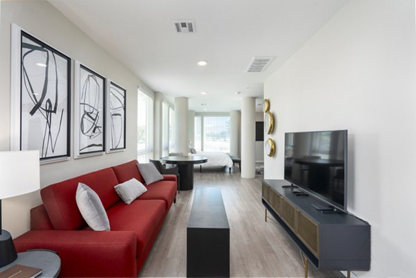 Spacious living room with modern furniture and neutral hues at Prado Apartments, a Greystar luxury property in the heart of the city