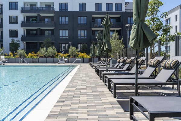 Sparkling outdoor pool at Prado Apartments offering a luxurious swimming experience Perfect for relaxation and leisure in a premium setting
