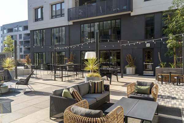 Tranquil garden courtyard at Prado Apartments, featuring lush landscaping and comfortable seating for residents