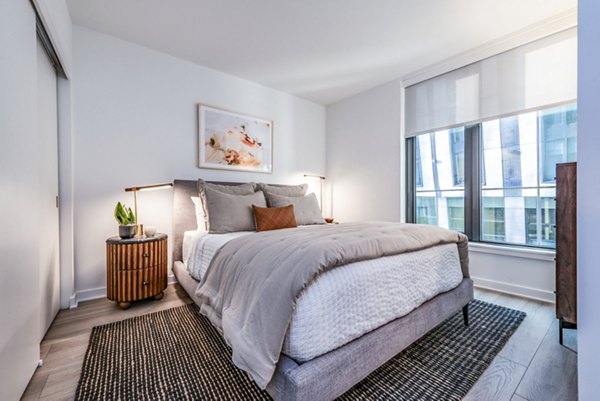 Elegant bedroom with natural light and chic decor in The Hale 20203