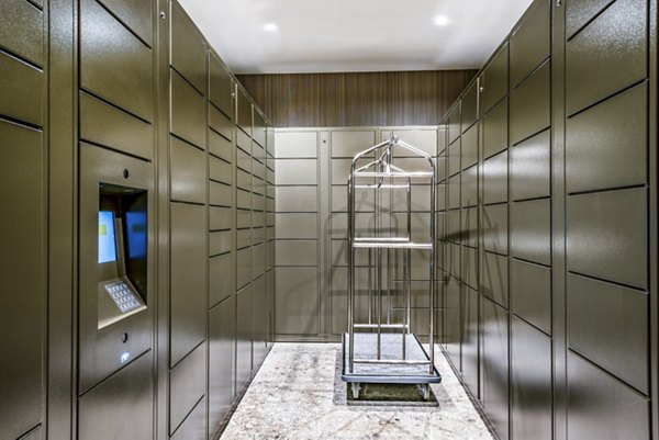 Package locker room with convenient luggage cart for easy transportation in luxury apartments