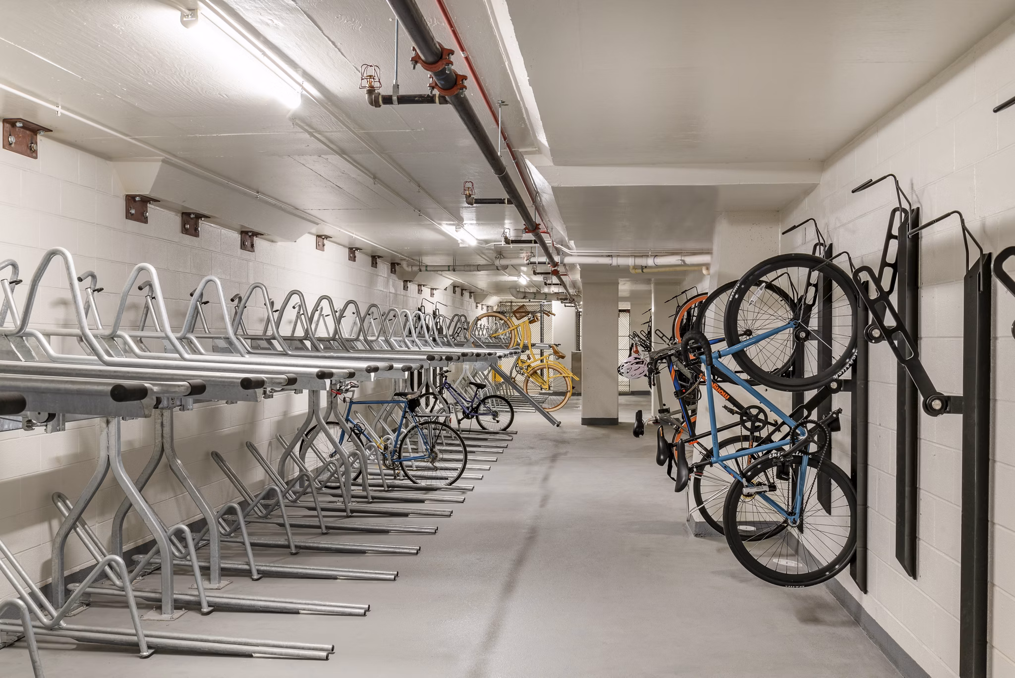 Bicycle storage room with organized racks for bikes at luxury apartments