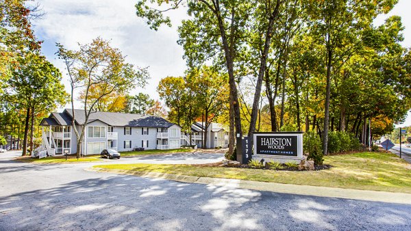 Signage at Hairston Woods Apartments: Modern entrance with vibrant community branding