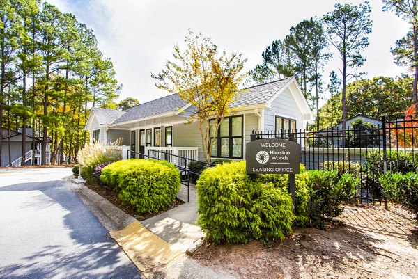 Clubhouse at Hairston Woods Apartments: Modern social space featuring outdoor patio and seating area in Hairston Woods community