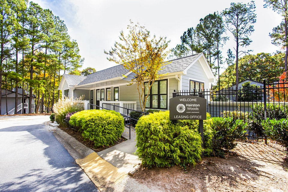 Clubhouse at Hairston Woods Apartments: Modern social space featuring outdoor patio and seating area in Hairston Woods community