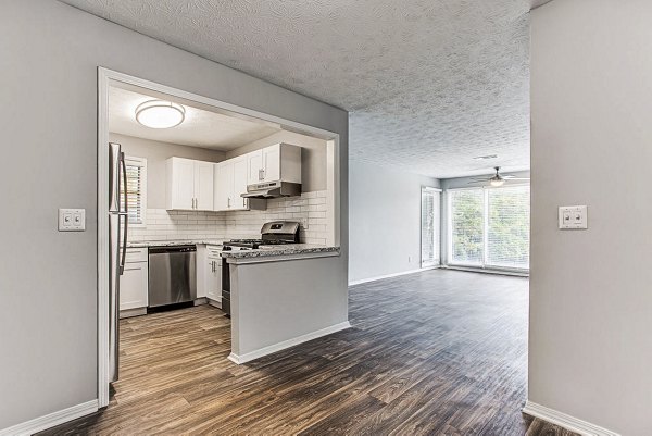 Modern kitchen with stainless steel appliances at Hairston Woods Apartments