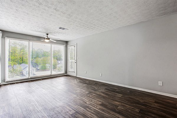 Spacious living room with modern decor at Hairston Woods Apartments
