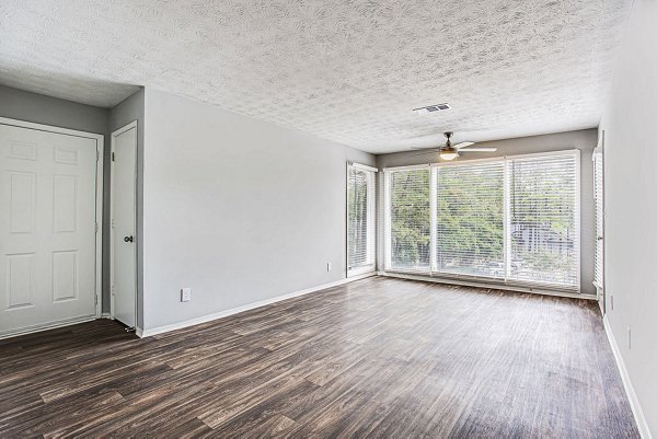 Spacious living room with contemporary decor in Hairston Woods Apartments