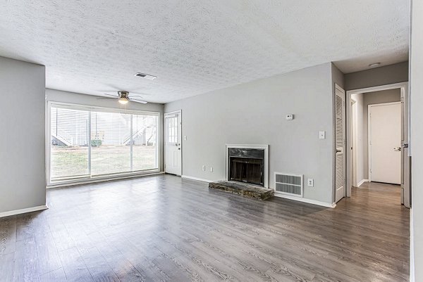 Spacious living room with modern decor at Hairston Woods Apartments