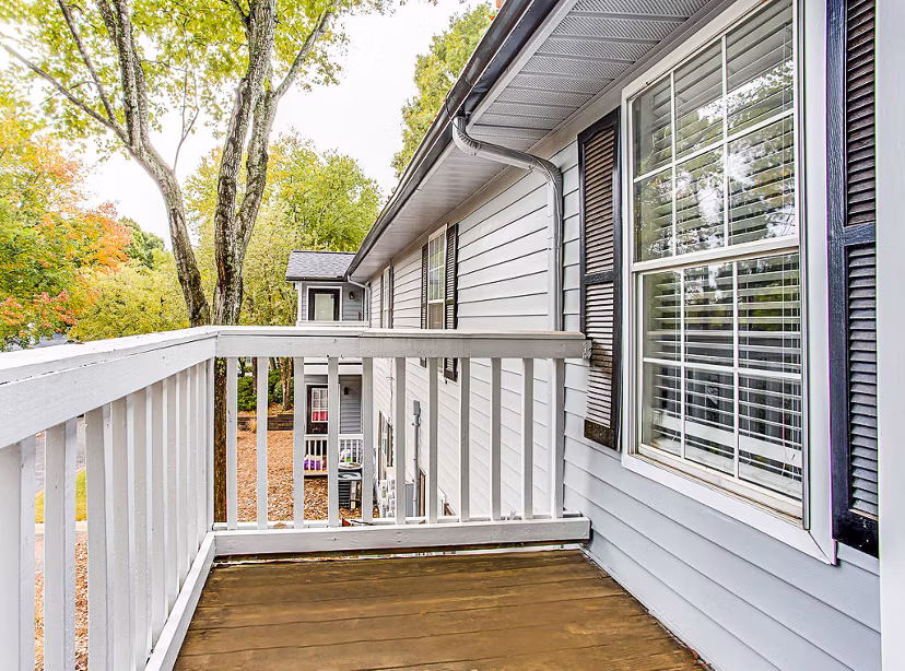 Spacious balcony with green views at Hairston Woods Apartments luxury living