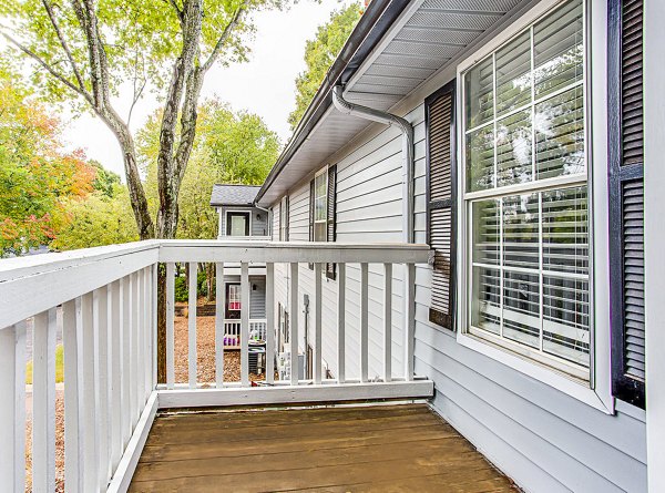 Spacious balcony with green views at Hairston Woods Apartments luxury living