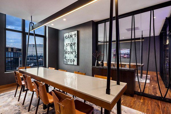 Clubhouse with modern design and cozy seating at The Metlo Apartments in Chicago