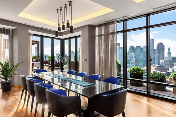 Meeting room with modern design and AV equipment at The Metlo Apartments, ideal for hosting corporate events or gatherings