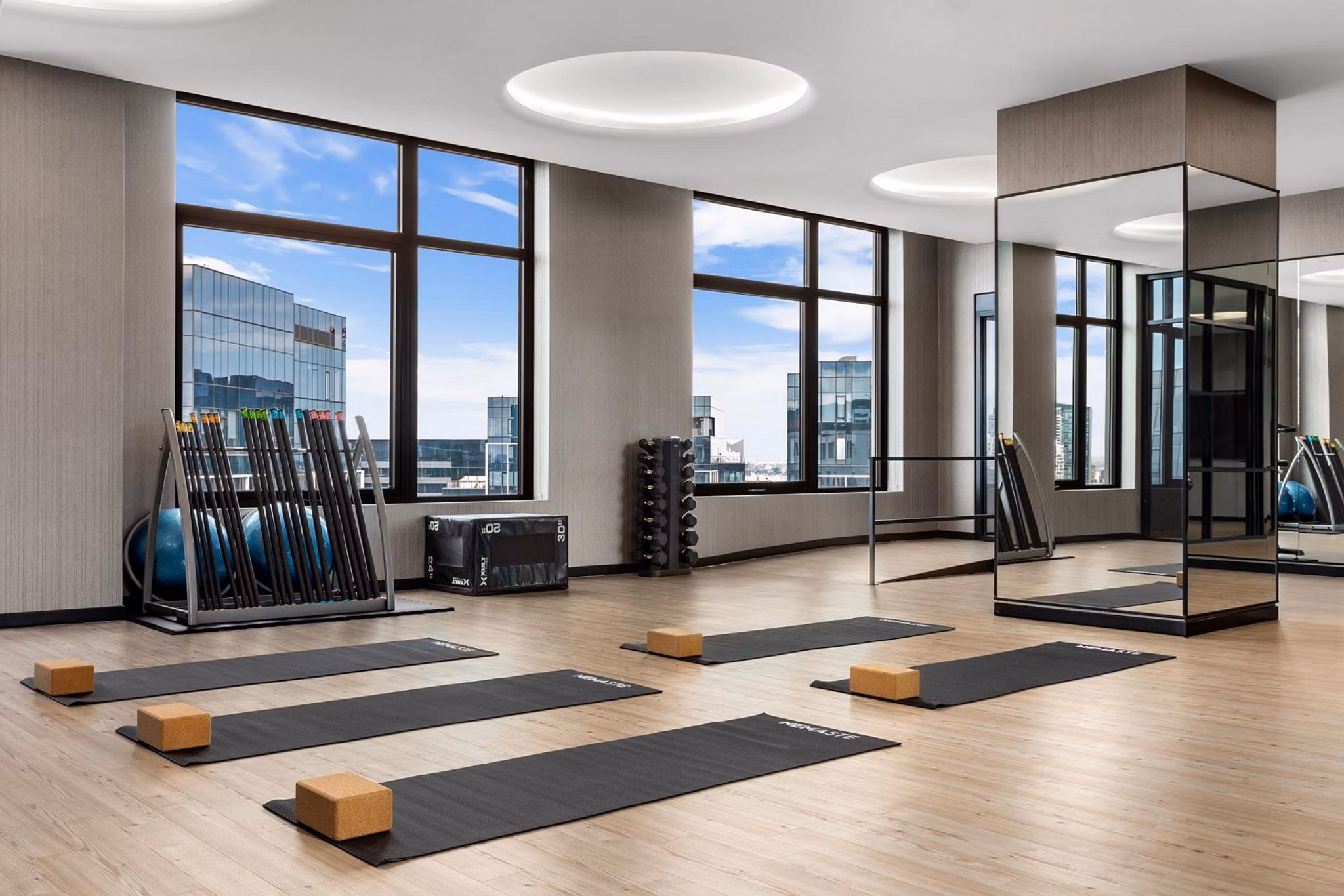 Yoga and spin studio with modern equipment at The Metlo Apartments