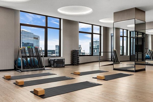 Yoga and spin studio with modern equipment at The Metlo Apartments