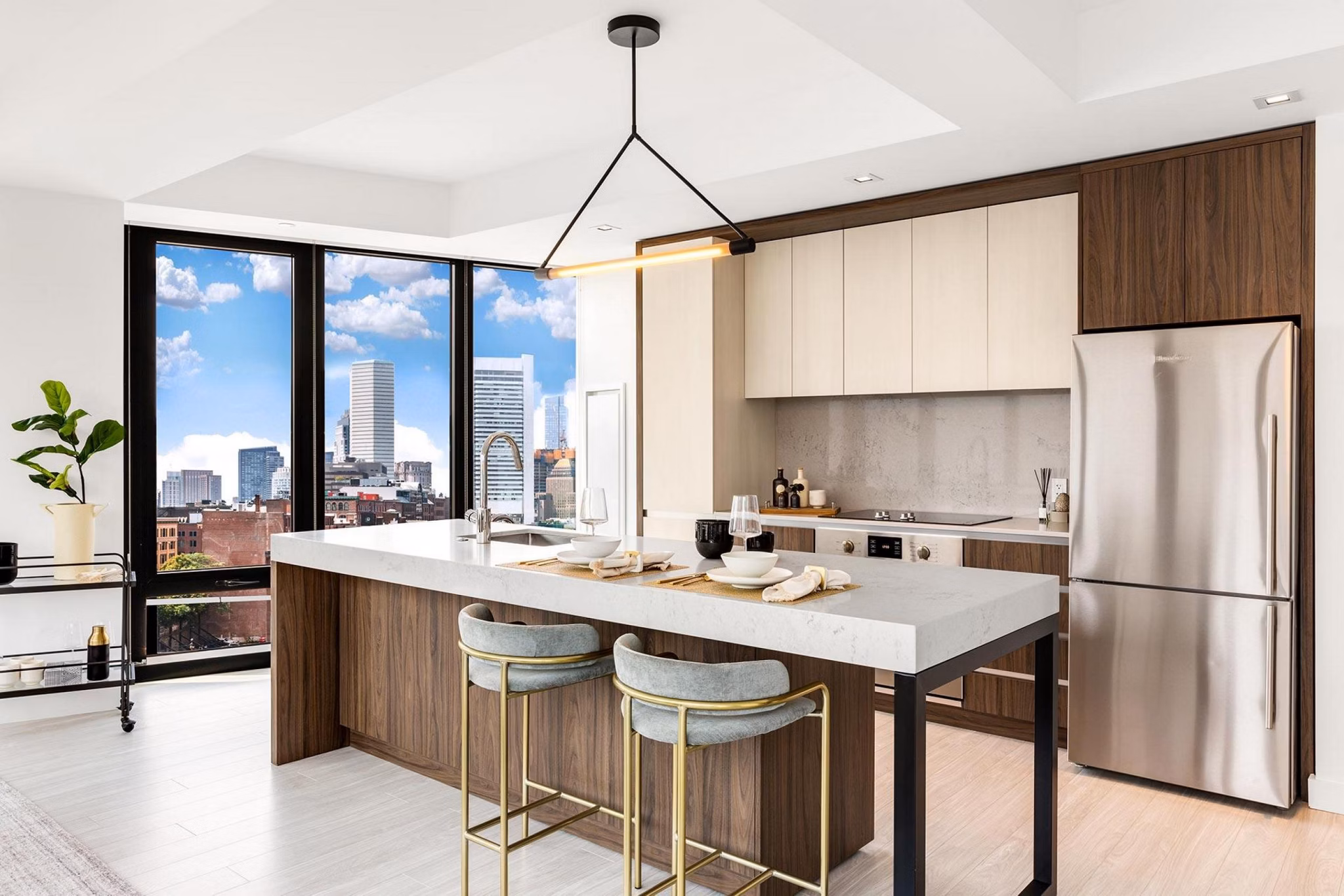 Modern kitchen with stainless steel appliances at The Metlo Apartments