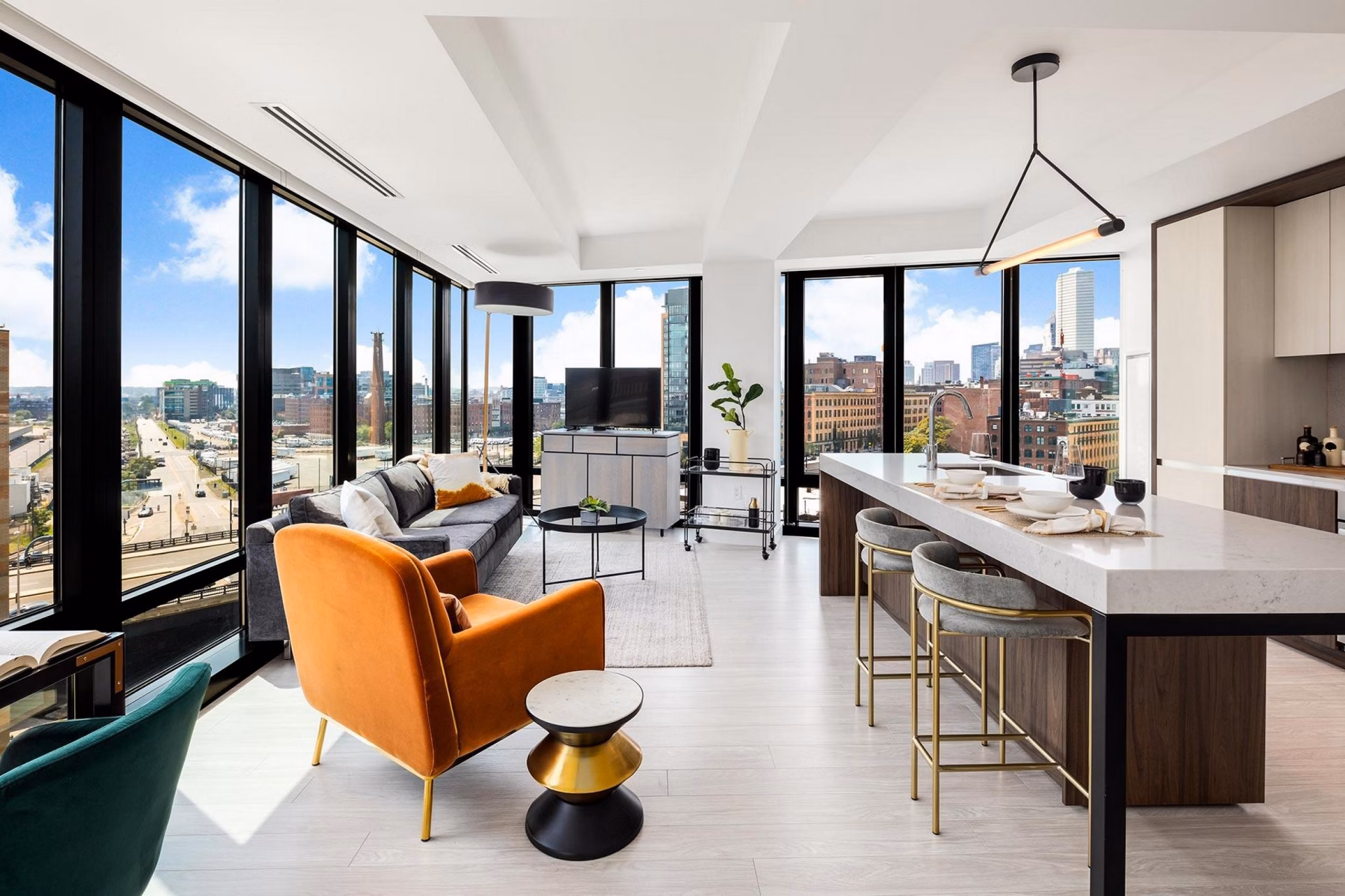 Modern kitchen with stainless steel appliances and granite countertops at The Metlo Apartments