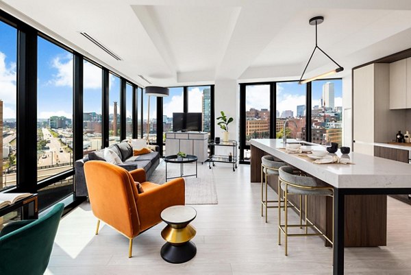 Modern kitchen with stainless steel appliances and granite countertops at The Metlo Apartments