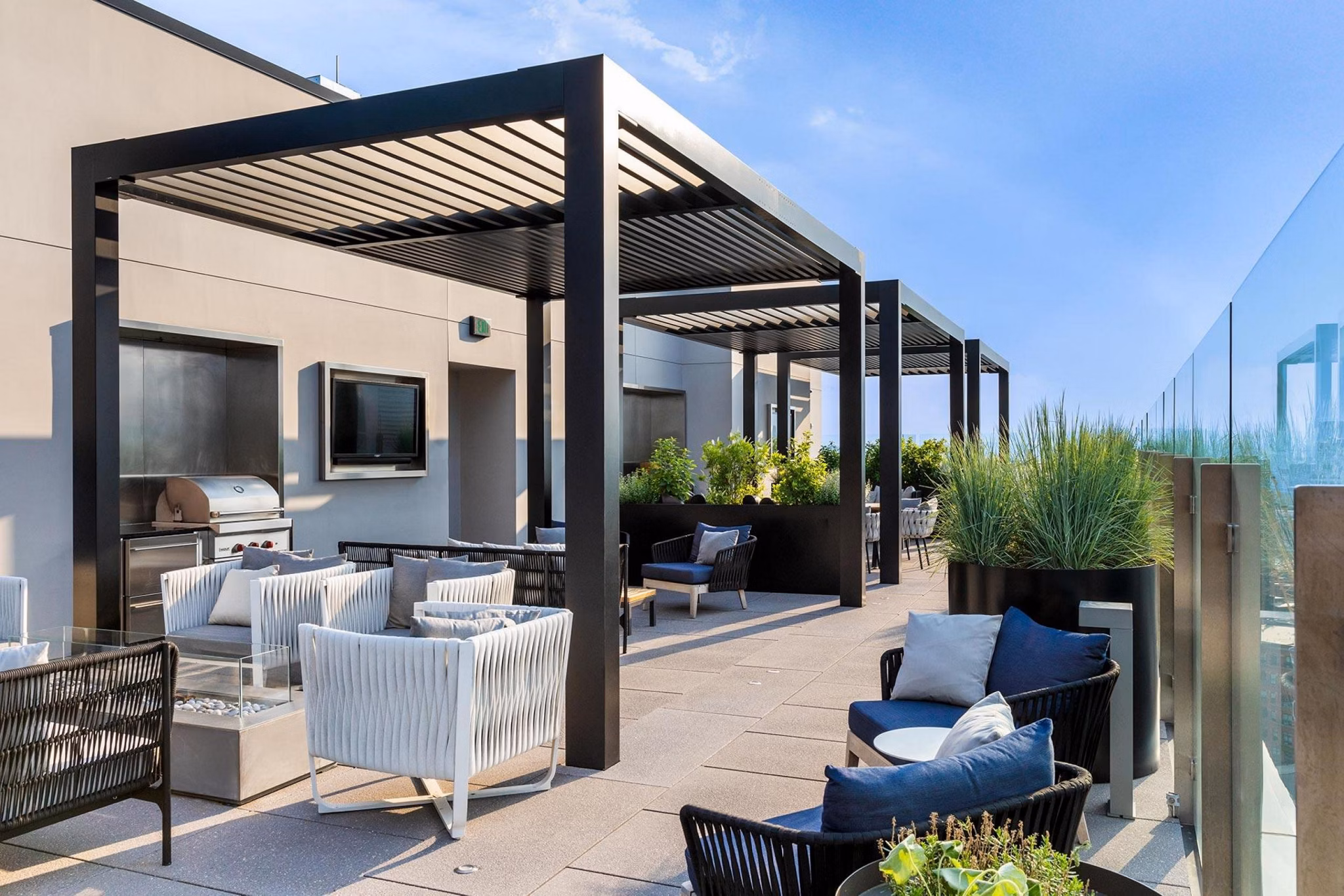 Grill area with modern seating at The Metlo Apartments