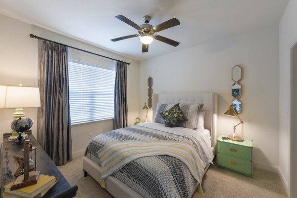Cozy bedroom with modern decor at Urban Crest Apartments