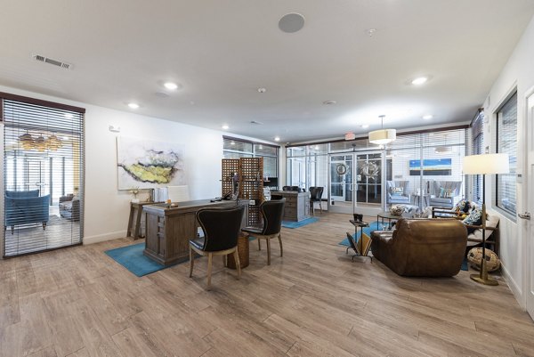 Modern clubhouse featuring sleek decor and spacious seating at Urban Crest Apartments, perfect for social gatherings