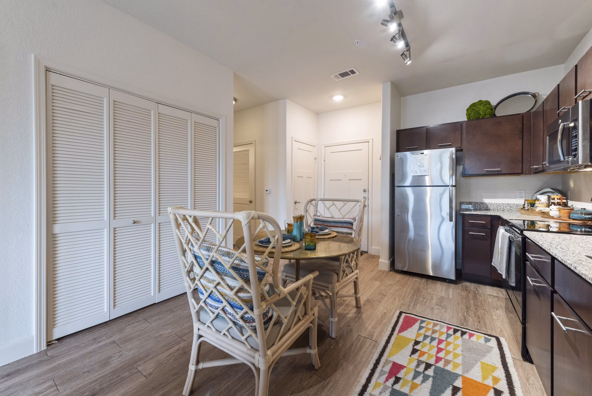 Dining area featuring modern decor and elegant lighting at Urban Crest Apartments
