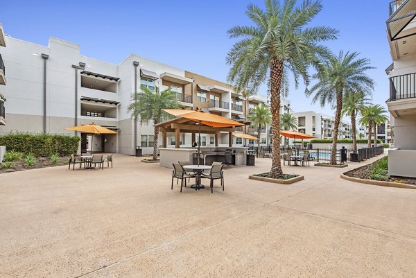 Tranquil courtyard with lush greenery at Urban Crest Apartments offering a serene retreat for residents