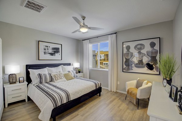 Cozy bedroom with modern decor at Town Germann Apartments