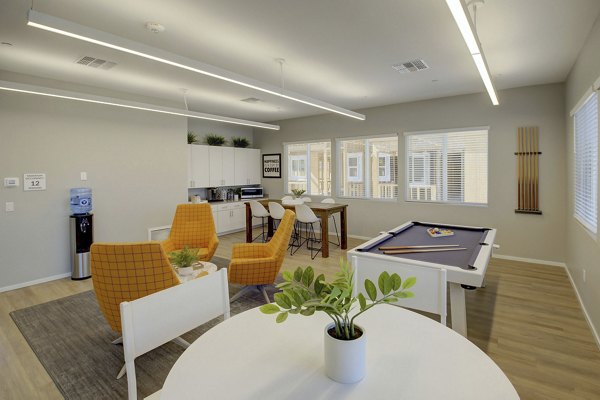 Modern clubhouse with elegant seating and game area at Town Germann Apartments luxury community