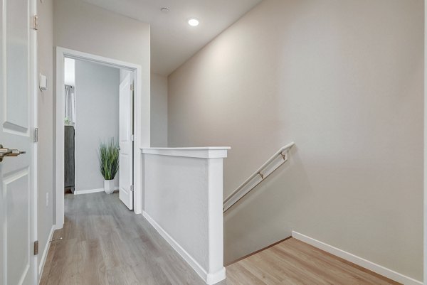 Elegant hallway with modern lighting fixtures in Town Germann Apartments