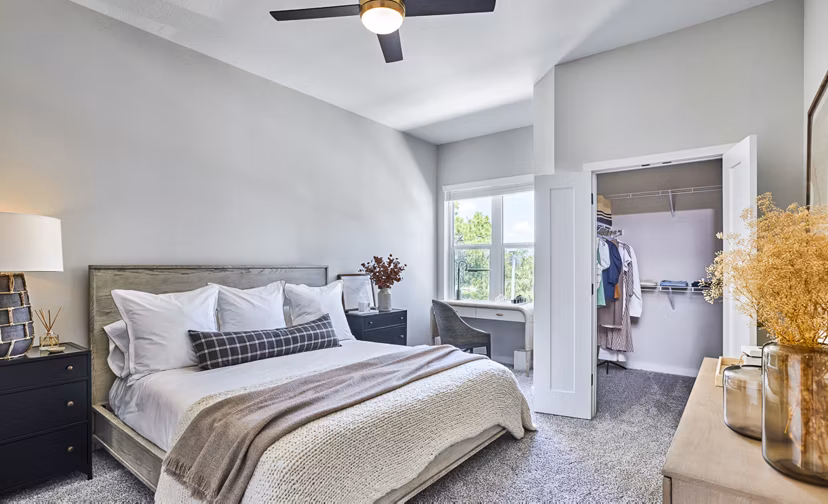 Modern bathroom with marble countertops and walk-in shower at Asbury Apartments
