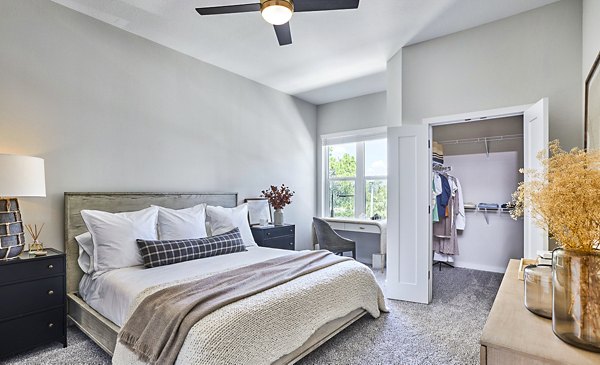 Modern bathroom with marble countertops and walk-in shower at Asbury Apartments