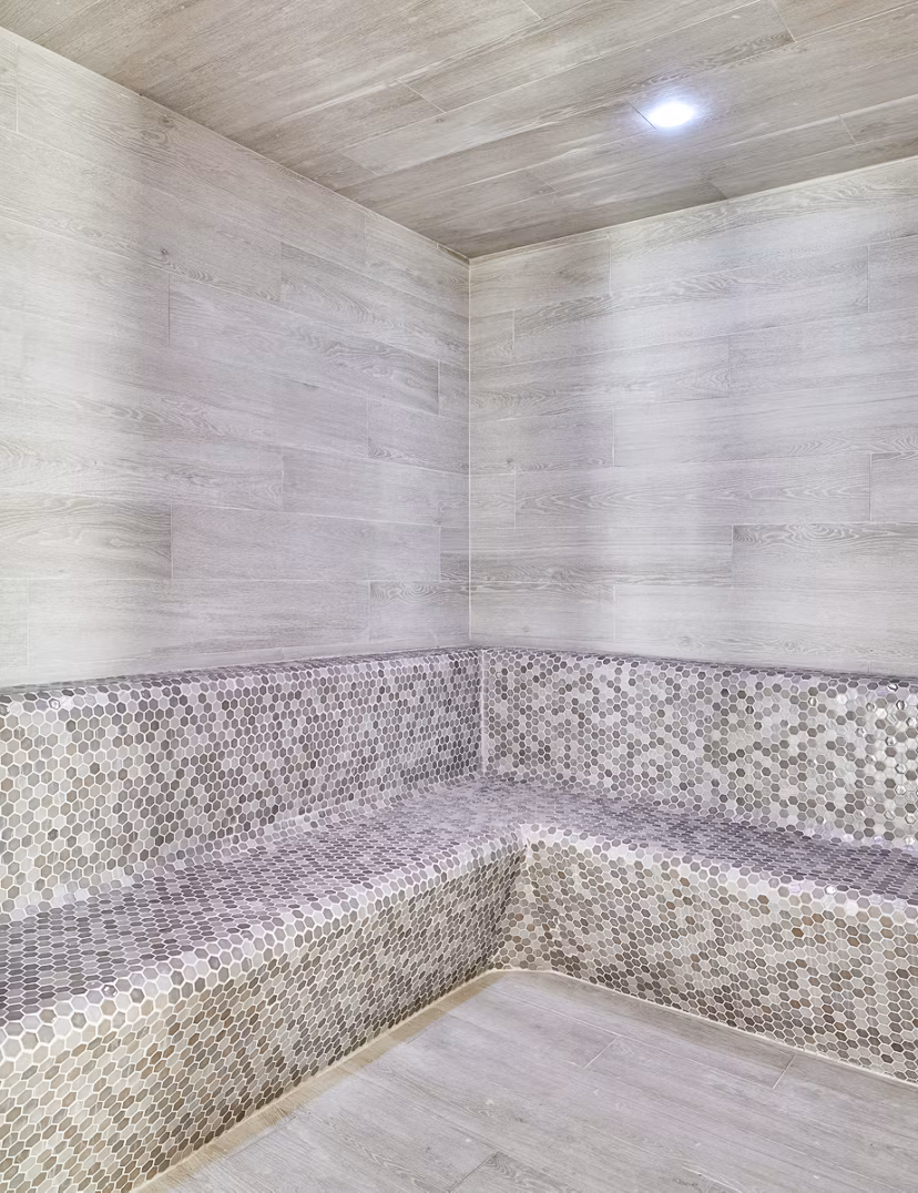 Relaxing sauna room with wooden interiors at Asbury Apartments clubhouse