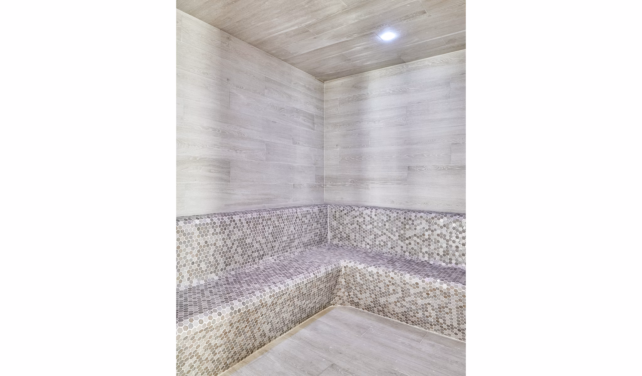 Relaxing sauna room with wooden interiors at Asbury Apartments clubhouse