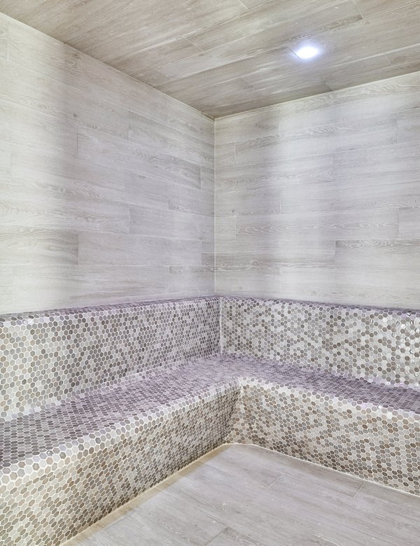 Relaxing sauna room with wooden interiors at Asbury Apartments clubhouse