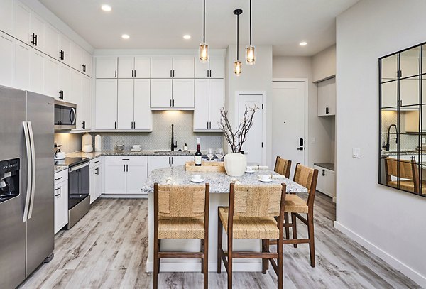 Dining area with modern kitchen features at Asbury Apartments, Greystarâ€™s luxury apartment community