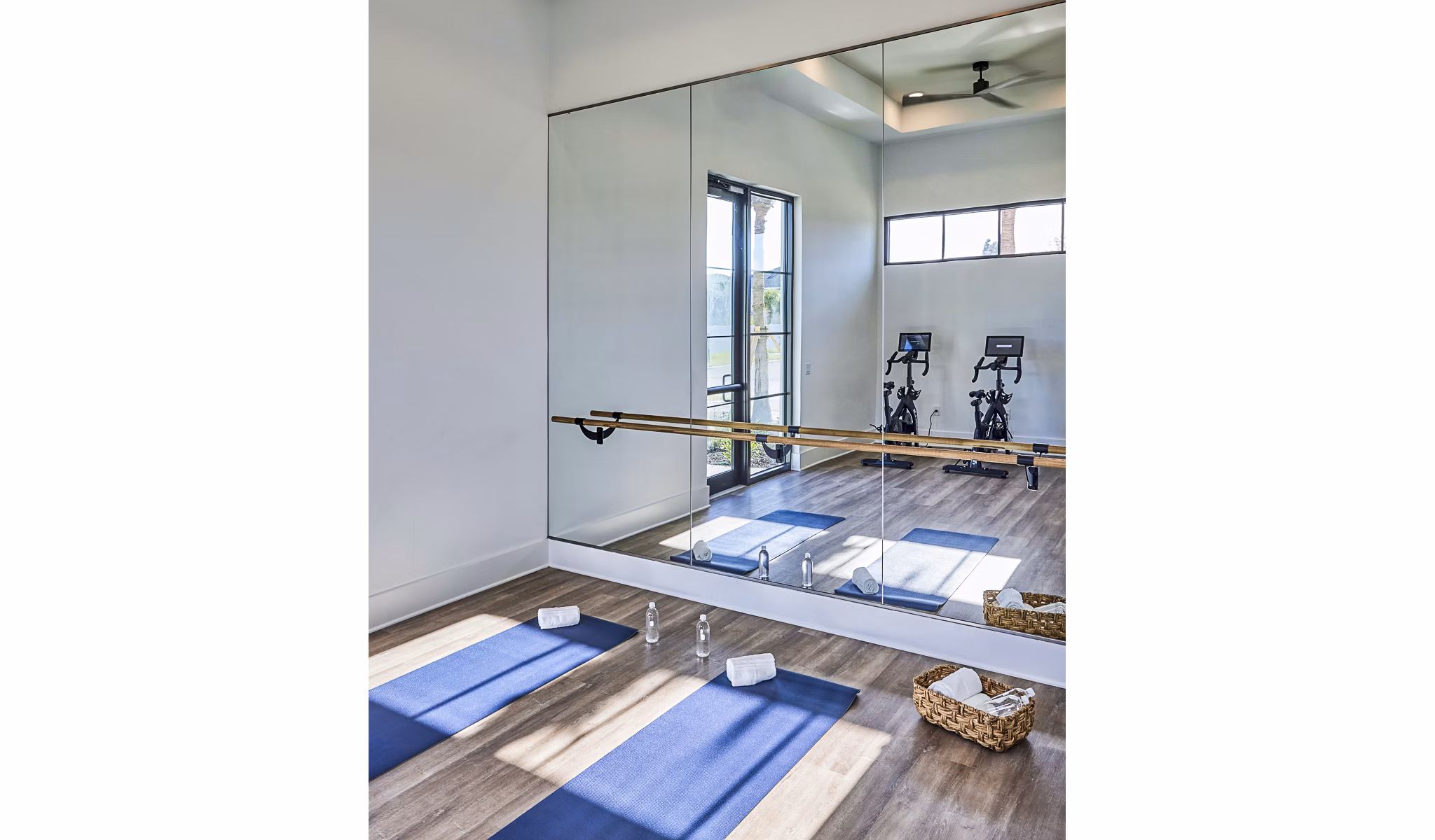 Yoga and spin studio with modern equipment at Asbury Apartments offering luxury fitness amenities