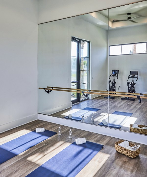 Yoga and spin studio with modern equipment at Asbury Apartments offering luxury fitness amenities