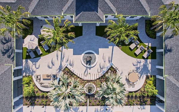 Patio with modern seating and greenery at Asbury Apartments, offering a relaxing outdoor space for luxury living