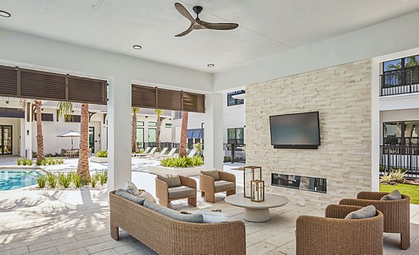 Spacious outdoor patio with modern seating at Asbury Apartments